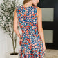Meadow Mischief Sleeveless Romper in Navy/Orange/Teal