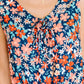 Meadow Mischief Sleeveless Romper in Navy/Orange/Teal