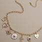 CHARM NECKLACE-HEART CROSS SUNBURST STONE